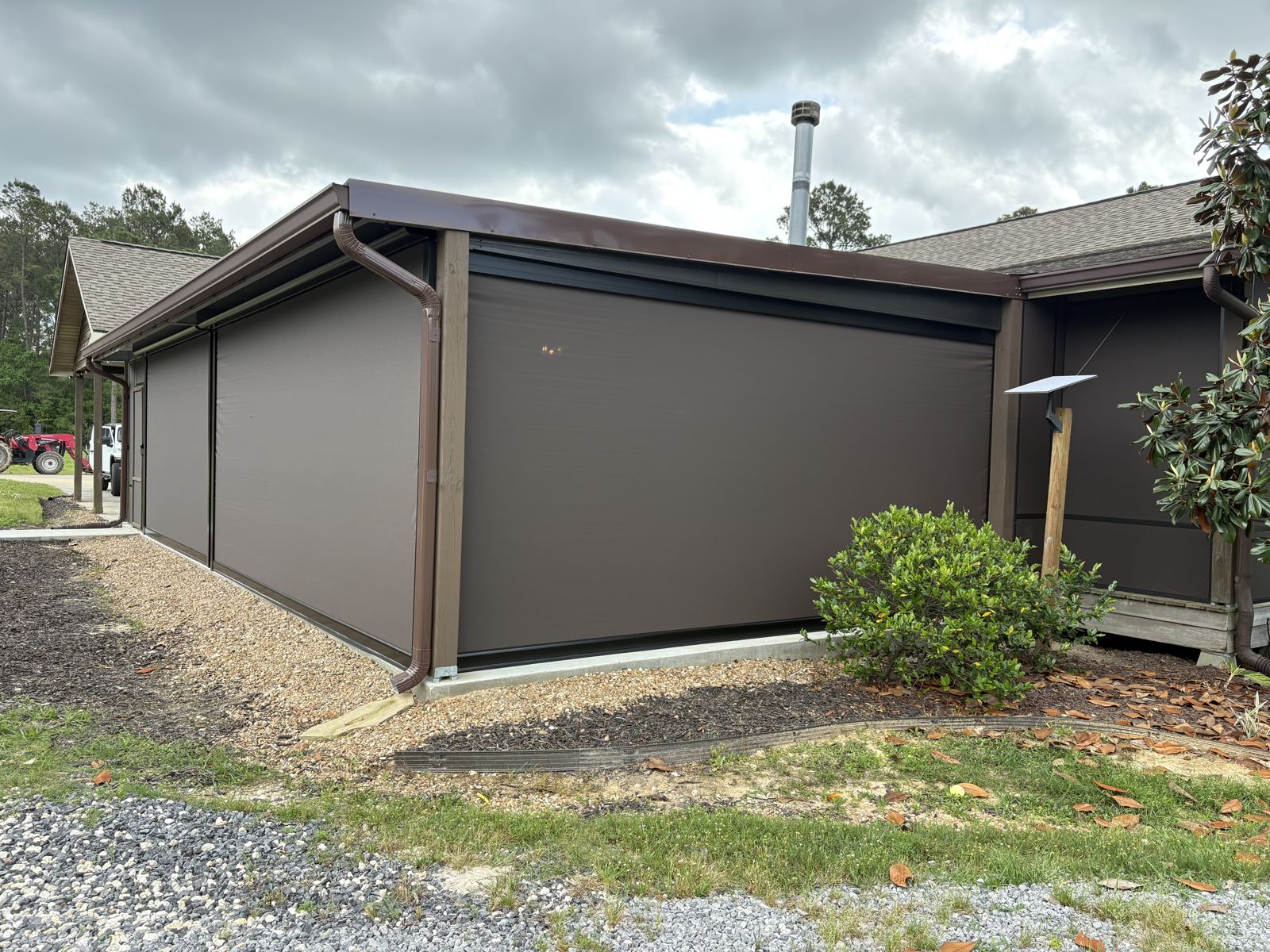 Corner of a building enclosed with large brown shade panels