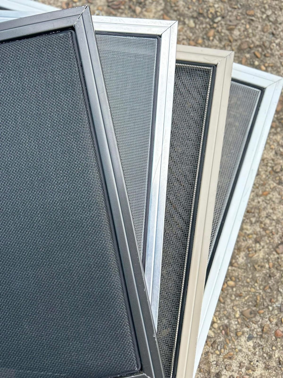 Window screens in dark, mill aluminum, tan and white finishes